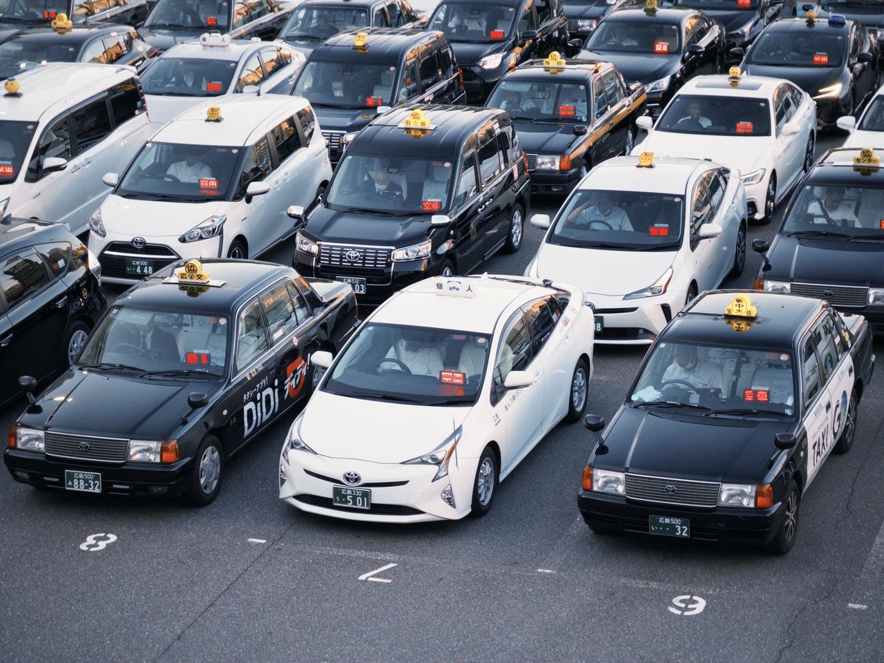 Crafting Captivating Headlines: Your awesome post title goes here Taxis lined up in a parking lot, showcasing urban transportation in Japan.